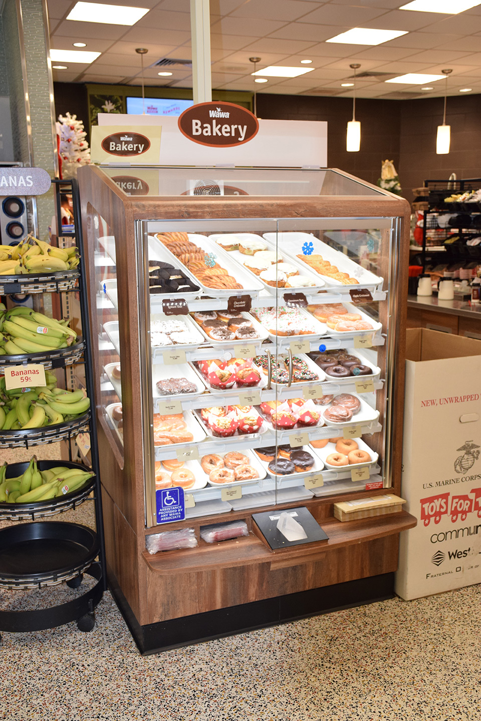 Wawa cigarette checkout area with point-of-sale candy and a breakfast sandwich display case
